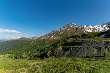 Green mountains with snow and ice