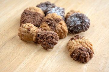Cinnamon sandbakelse christmas cookies, two color, cocoa dark brown and vanilla light golden brown, delicious cookies