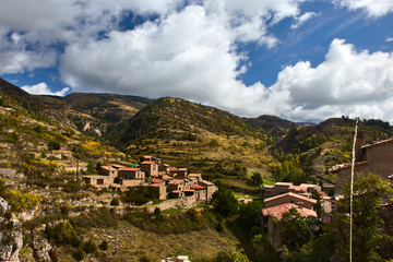  Small village in the mountain and cloudy sky