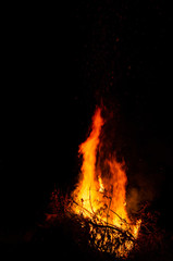 Fototapeta premium Night campfire with available space at left side.