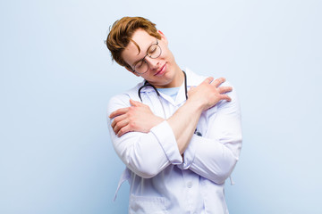 young red head doctor feeling in love, smiling, cuddling and hugging self, staying single, being...