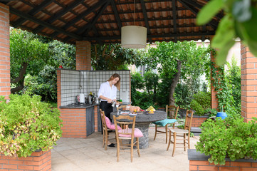 girl cooked breakfast and drinks coffee with great pleasure