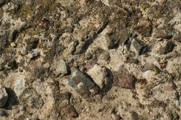 A texture of cracked paint on a concrete wall