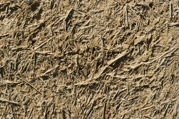 Old wall of a combination of red clay and straw