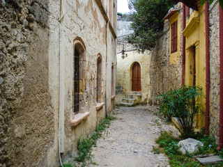 Fototapeta na wymiar a narrow cozy street of the ancient Mediterranean city