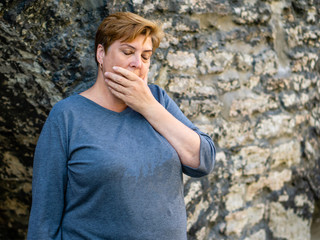 Mature woman walking around the old town