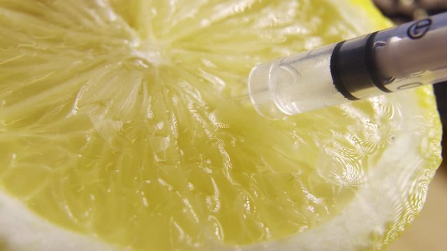 Extracting vitamin C from lemon. Suitable for concepts as Vitamins and flu vaccines for protection against swine flu or Genetically Modified organism