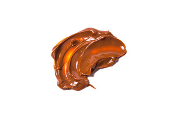 Melted tasty caramel splashes isolated on white background.