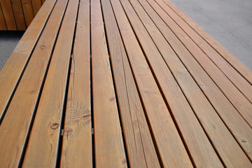Light brown wooden background. Boards going into the distance.