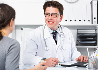 Doctor speaking with client in the medical center