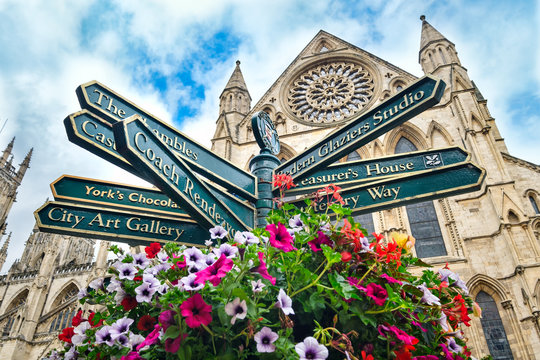 The York Minster and a sign with directions to landmarks in the city