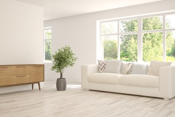 Stylish room in white color with sofa and summer landscape in window. Scandinavian interior design. 3D illustration