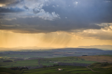 Setting sun highlighting rain over Yorkshire countryside