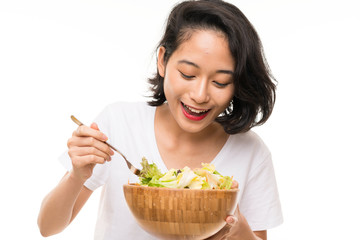 Asian young woman over isolated background with salad