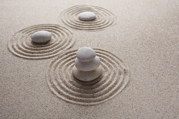 Fototapeta na wymiar Japanese zen garden stone for concentration and relaxation sand and rock for harmony and balance