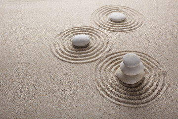 Fototapeta na wymiar Japanese zen garden stone for concentration and relaxation sand and rock for harmony and balance