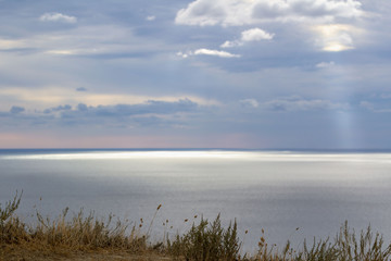 calm landscape sea merging on the horizon with cloudy sky