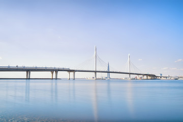 Seascape in Saint Petersburg with cable-stayed bridge and distant skyscraper