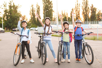 Obraz premium Cute children riding bicycles outdoors