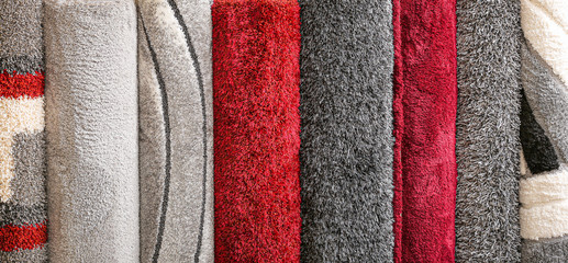 Many different carpets in shop