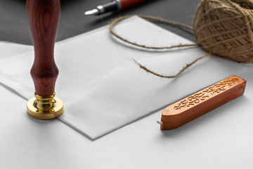Notary public wax stamper. White envelope with brown wax seal, golden stamp. Responsive design...