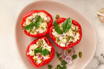 Plate with tasty stuffed pepper on table