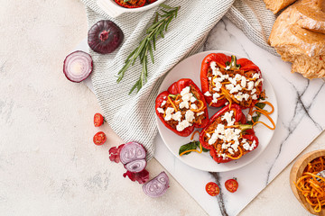 Plate with tasty stuffed pepper on table