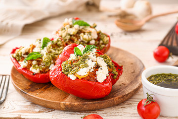 Plate with tasty stuffed pepper on table