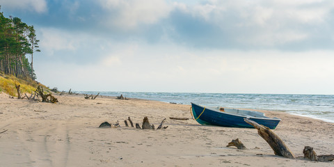 During a storm, an empty boat is washed ashore.