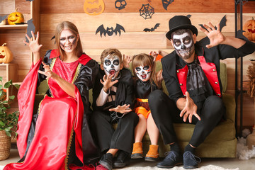 Fototapeta na wymiar Family celebrating Halloween at home
