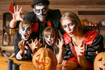 Family celebrating Halloween at home