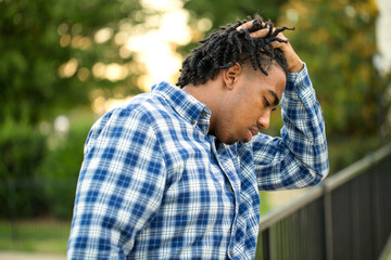 Young African American man in deep thought.