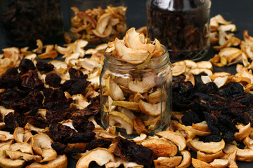 Homemade dried apples, plums and pears in glass jars, Horizontal orientation, Closeup