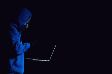 hacker man terrorist with virus computer attack to server network system online in data internet...