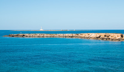 Fototapeta premium Lighthouse near ionian sea (St Andrea Island), Gallipoli, Salento, South Italy