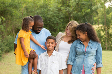 Portrait of a multi ethnic family laughing.