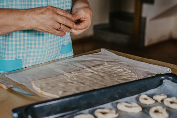 hands cooking making donuts or traditional sweets