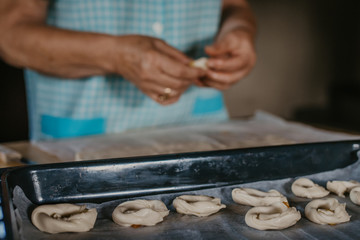 hands cooking making donuts or traditional sweets