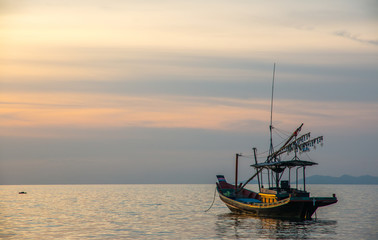 Fishermen boat at sunset near Koh Phangan island, Thailand