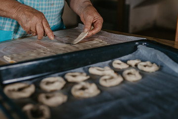 hands cooking making donuts or traditional sweets