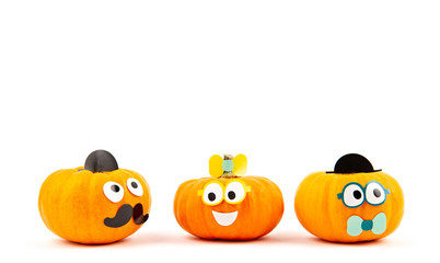 Funny pumpkins with googly eyes over the white background. Funny party invitation; halloween celebration concept