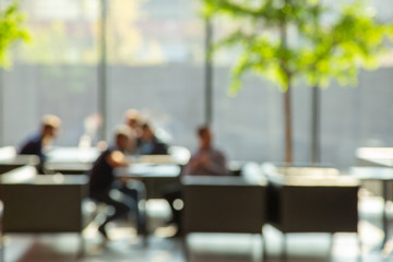 Blur image of open space for negotiations and relaxation with big window.
