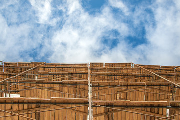 Scaffolding on the facade of the building. Equipment for construction work.
