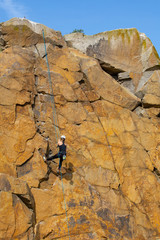 woman climber on the wall, Bornholm,Vang