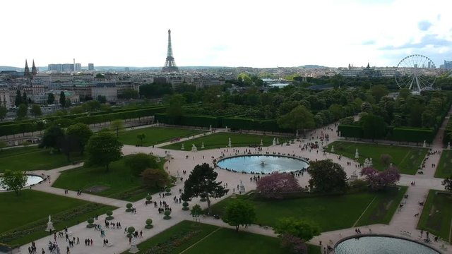 Aerial drone flying over Tuileries Garden Paris city skyline landscape Eiffel Tower in background