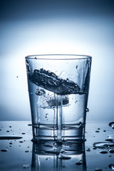 splashing clean water in a glass