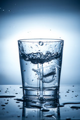 splashing clean water in a glass