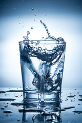 splashing clean water in a glass