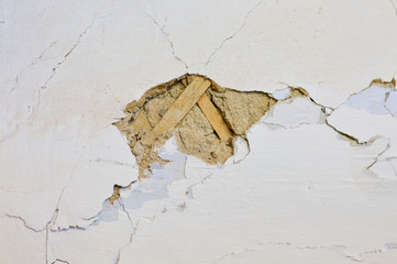 Crack in the wall, the destruction of the building.