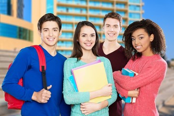 Group of students with books on background